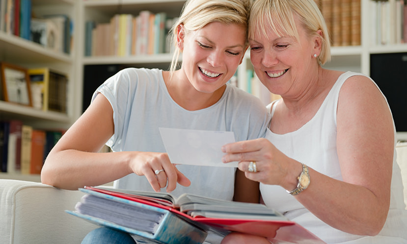 Two women viewing image from a photo album