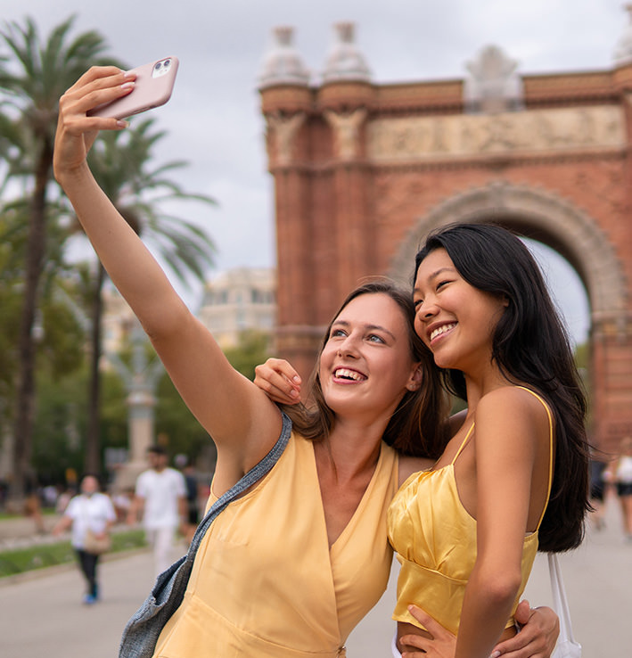 Two women taking a selfie image